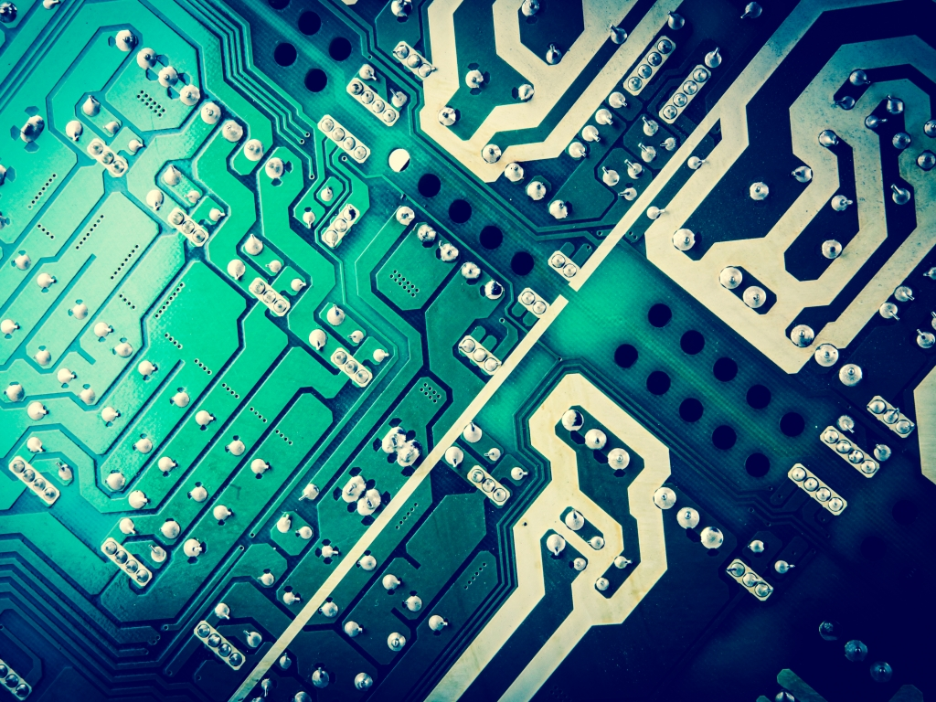 High-density silicon layout for professional IC Design Services showing complex trace routing.